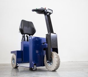 Zallys K2 Stand-On Electric Tug towing warehouse trolley