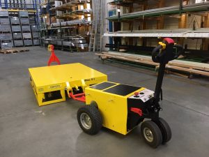 Alitrak OT-2500 electric tug for reducing physical effort during material handling
