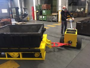 Electric tow tug used for efficient movement of heavy wheeled equipment
